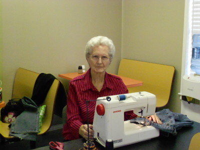Long time friend Sister Mary doing alterations for the students